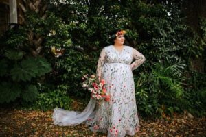 Plus size cruvy unique wedding gown with lace and floral crown