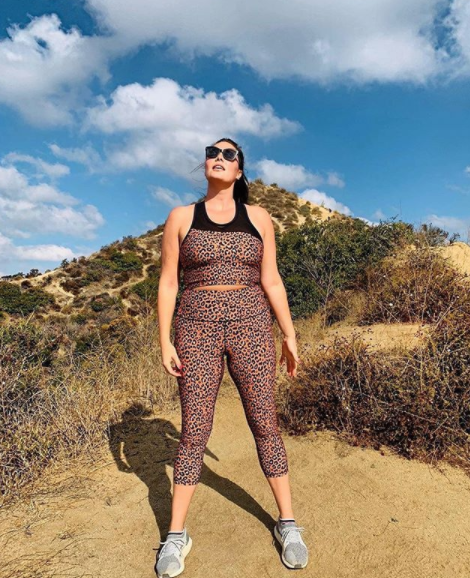 Plus size supermodel Candice Huffine wearing cheetah print workout pants  in Daywon