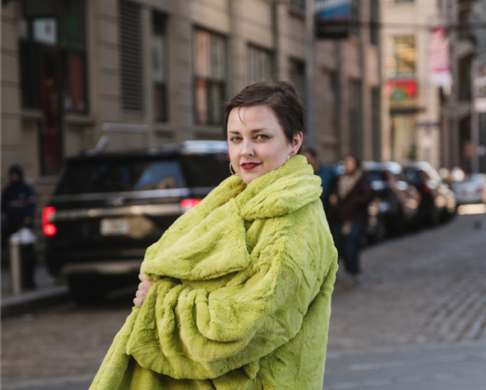 Plus size model and fashion blogger in Nuuly Faux Fur Coat