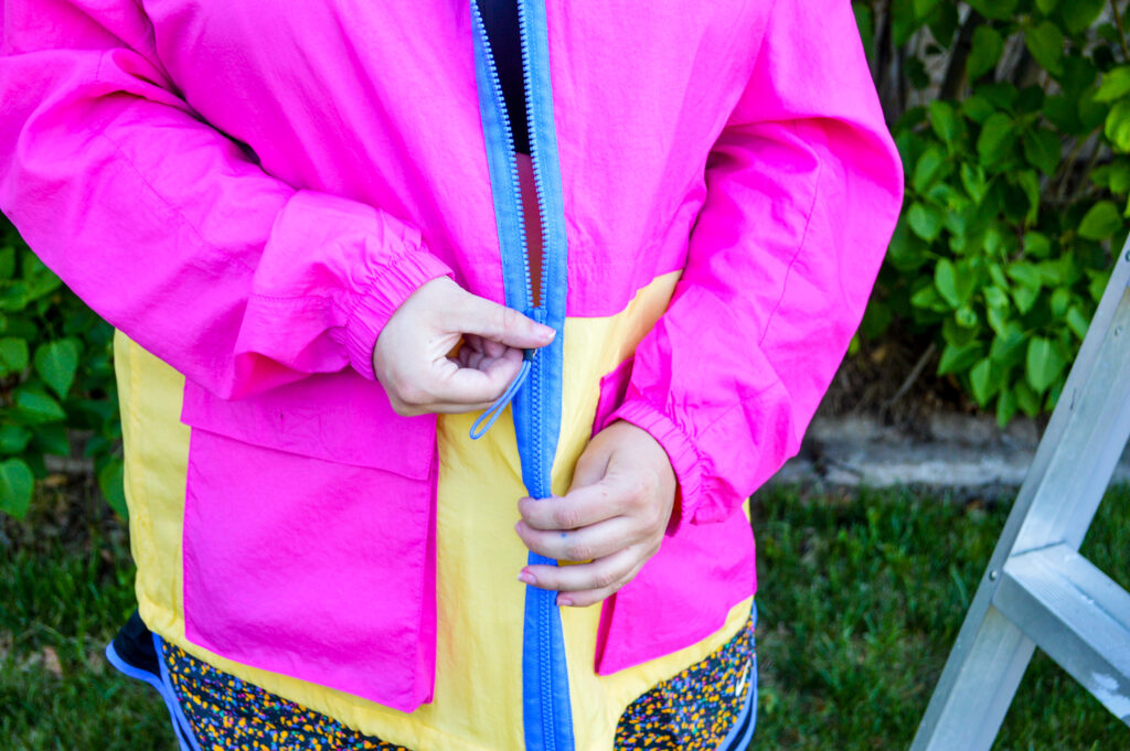 Bright pink and yellow Nike Sportswear Icon Clash Lightweight Woven Plus Size Jacket