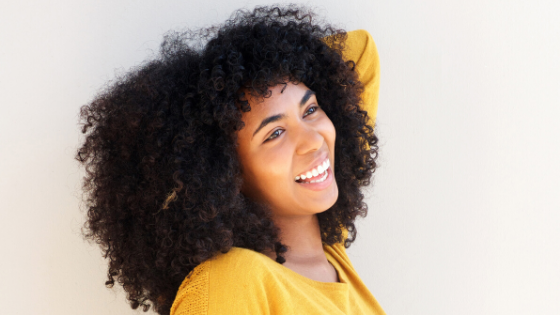 Happy woman smiling wind in her face