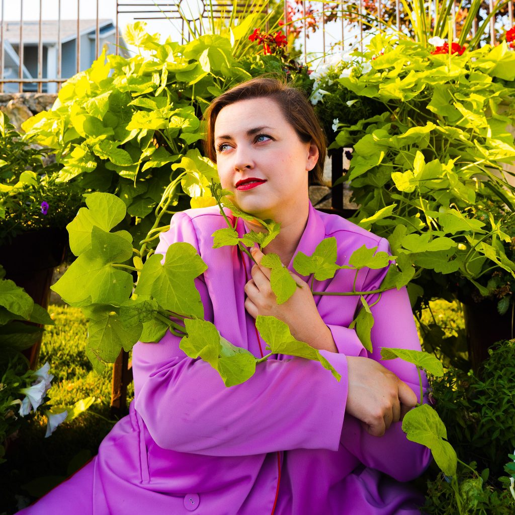 Blogger photoshoot at home plus size model in lavender suit from eloquii second hand fashion.jpg