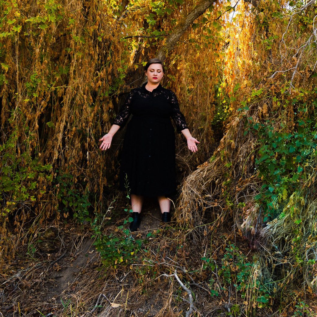 Plus size fall halloween witchy dress in forest with black boots inspired b Sabrina Netflix