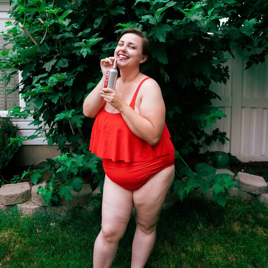 Plus size fashion blogger with Diet Coke in red swimsuit from Amazon Fashion