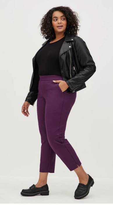 Cool plus size airport outfit with a faux leather jacket, black top and purple pont pants