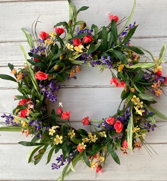 Front Door Wreaths for Summer - wildflower wreath with a riot of colors including bright red pink, purple, light green and dark green leaves and yellow flowers