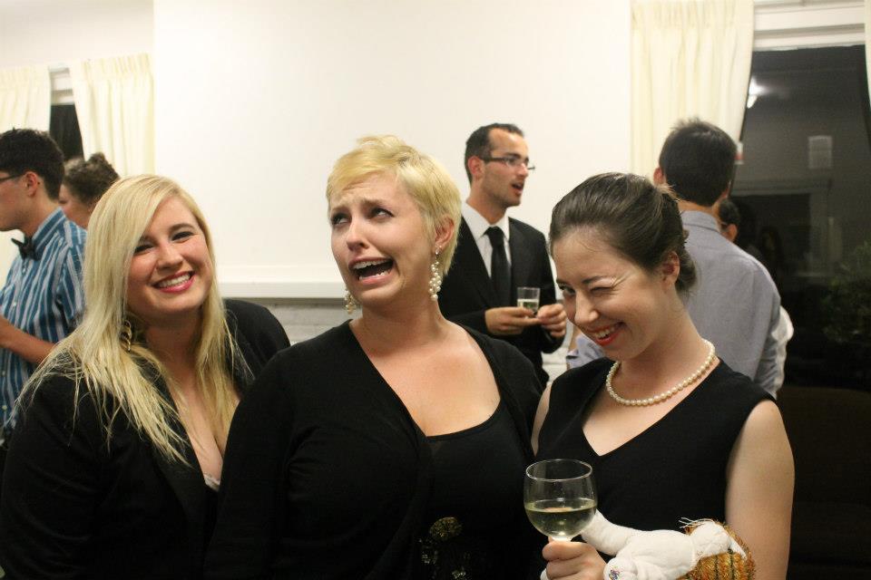 Brianne in the middle of two of her best friends, Kate and Kaitlin, at Kate's annual birthday party for Truman Capote.