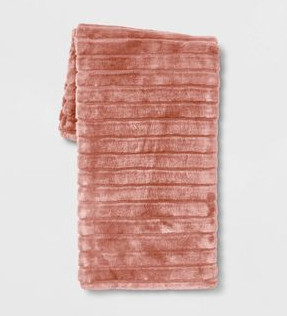 soft fuzzy pink throw blanket in light pink