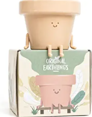 Cute Pot with smiling face and little arms and legs