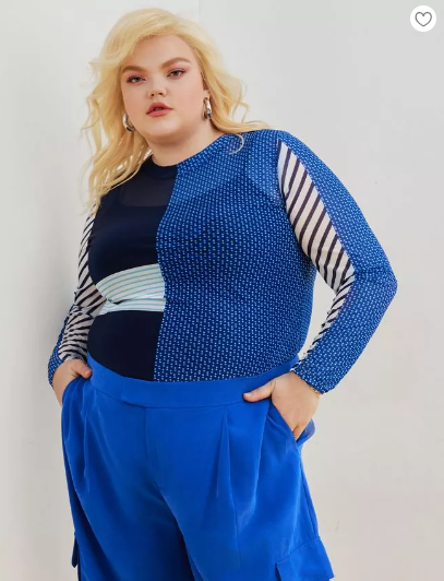 plus size airport outfit idea - mesh top that's colorblocked top in blue, black and white accents