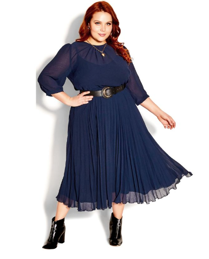 plus size business casual outfit idea - navy blue dress with faux black leather belt and shiny black booties that have a chunky heel